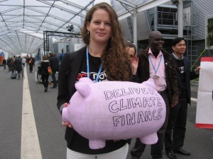 Young woman gathering money for climate justice finance